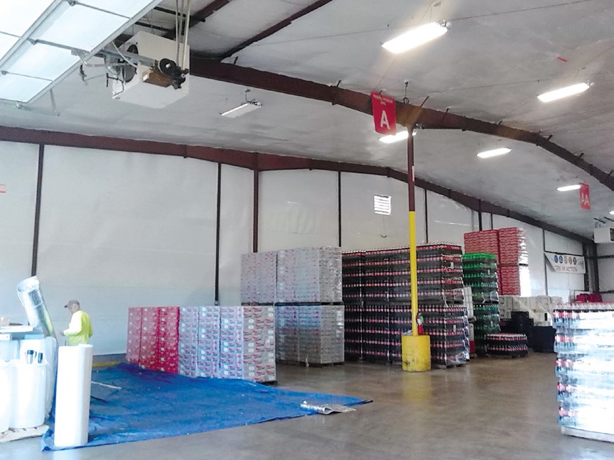 Interior of a warehouse with a reflective insulated roof